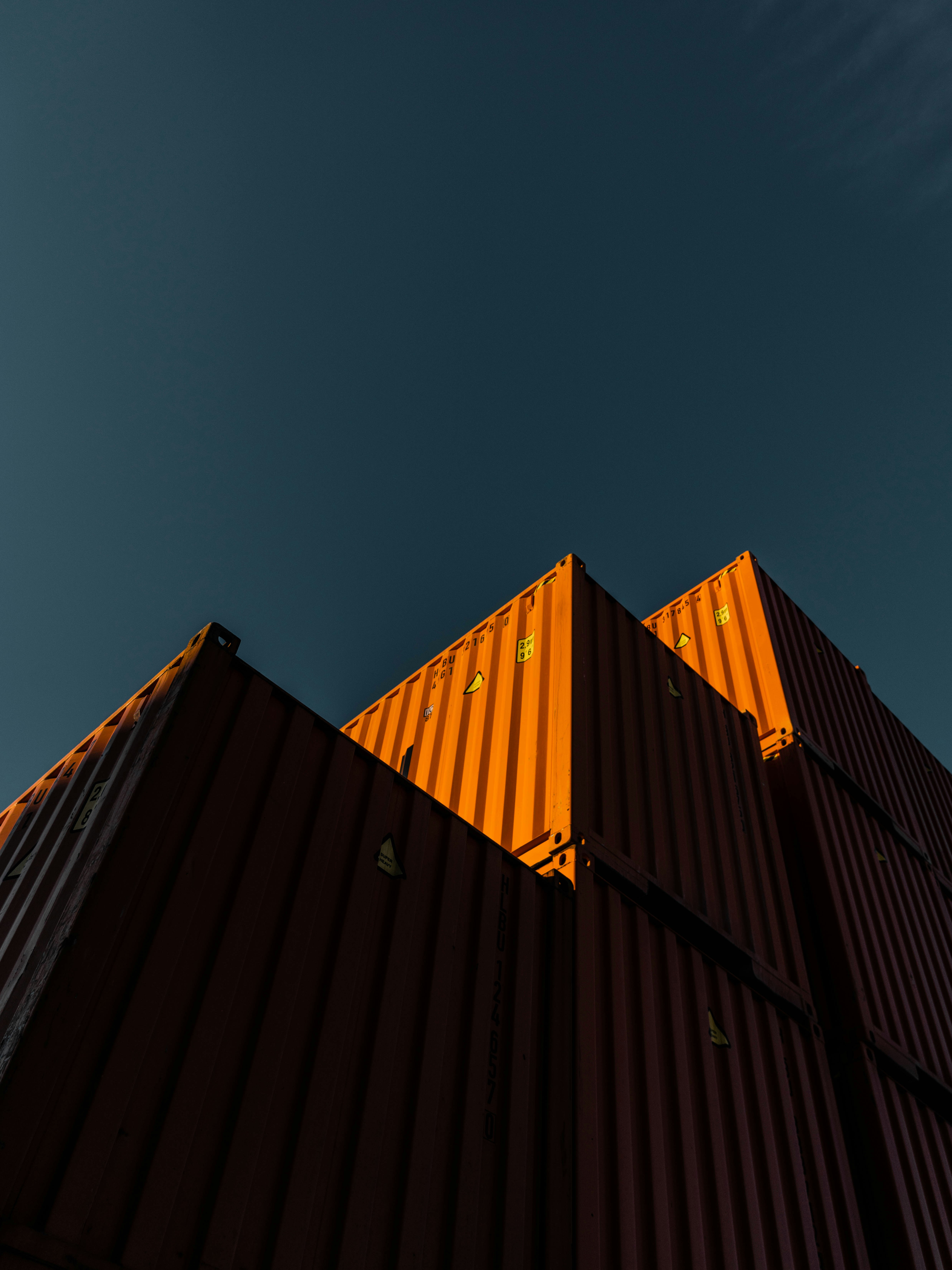 Stacked shipping containers — photo by Aron Yigin